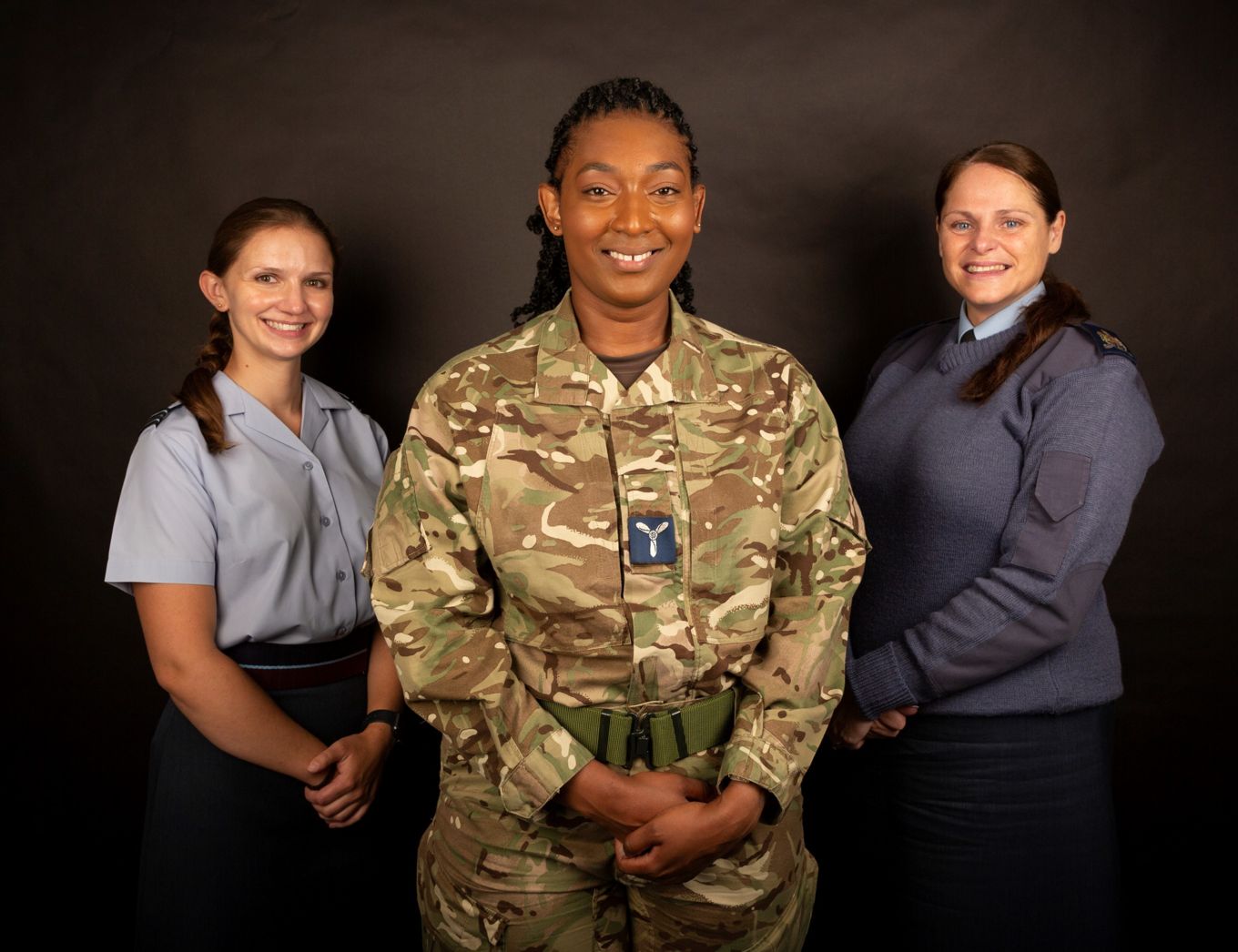 Images shows female aviators smiling for official portrait.